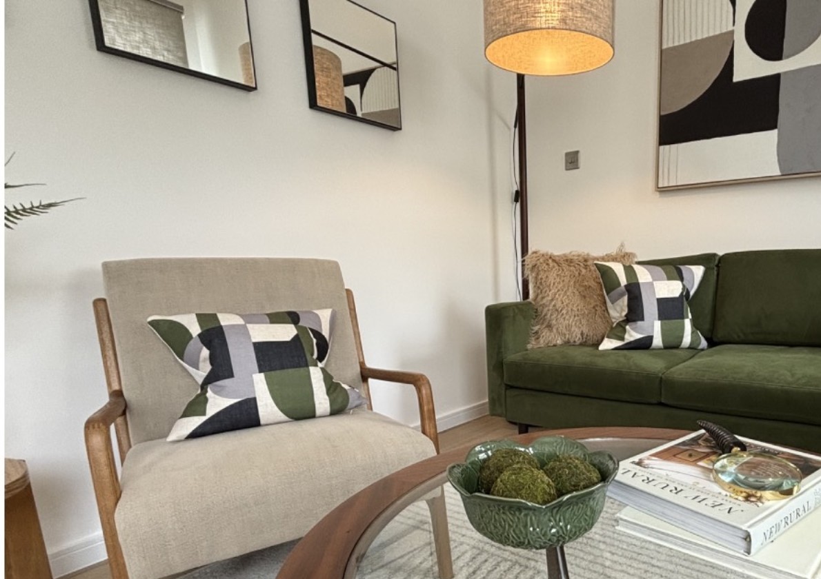 Olive green sofa in a styled Decoro Design living room